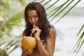 Close-up of a Drinking Beach Girl a Coconut Cocktail on a Tropical beach During Summer Vacation