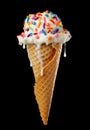 Close up of dripping and melting ice cream cone with vanilla icecream and a waffle cone covered in colorful sprinkles isolated on Royalty Free Stock Photo