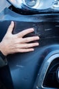 Close Up Of Driver Inspecting Damage To Car After Accident Royalty Free Stock Photo