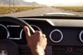 Close Up Of Driver's Hands On Car Steering Wheel