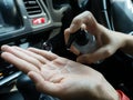 Close-up driver washing hands with alcohol gel to prevent infection corona virus covid-19 Royalty Free Stock Photo