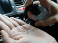 Close-up driver washing hands with alcohol gel to prevent infection corona virus covid-19 Royalty Free Stock Photo