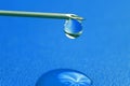 Close-up of a drop of medicine on the tip of a medical injection needle Royalty Free Stock Photo