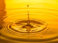 Close up of a drop oil on a yellow background Royalty Free Stock Photo