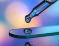 Close-up of Droplet Falling onto Surface with Reflection Royalty Free Stock Photo