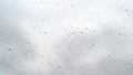 close-up, drops of water on the windshield of the car, while driving. From a strong wind, droplets flow down the glass Royalty Free Stock Photo