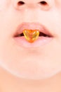 close up drug heart shape between lips