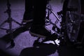 Close up of drummer`s foot wears sneakers moving drum bass pedal