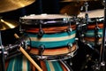 close-up of drumsticks on a custom drum set