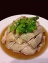 Close up of Drunken Hainanese Chicken, chinese style food, isolated on dark background