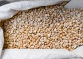 Close up on a dry raw chickpeas in a box. Macro. Healthy dietary food rich in microelements cellulose. Food for