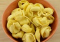 Dry raw tortellini pasta in bowl Royalty Free Stock Photo