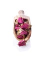 Close-up of dry red rose buds on wooden scoop Royalty Free Stock Photo