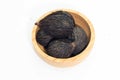 Closeup of Dry seed of fox tail palm on wooden bowl Royalty Free Stock Photo