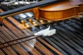 Close up of dulcimer strings and drumsticks with lying violins