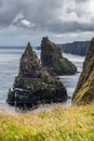 Close up of the scottish Duncansby Stacks under a gloomy sky