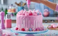 Close-up of e decorating delicious pink gourmet cake at home kitchen Royalty Free Stock Photo