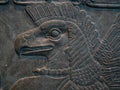 A close-up of an Eagle headed protective spirit carving. British Museum.
