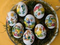 Close up on easter eggs on a yellow tablecloth with copy space Royalty Free Stock Photo