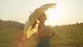 CLOSE UP: Easygoing blonde woman dances alone in the middle of rainy meadow.