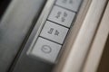 Close-up of eco button in a modern dishwasher control panel.