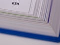 Close-up of the edge of an opened book with the page number Royalty Free Stock Photo