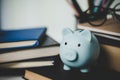 close-up education object with stack money coin-cash dollar and glass jar on background. Concept to saving money income for study Royalty Free Stock Photo