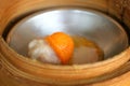 Close up egg yolk on streamd pork in bamboo basket in Chinese dim sum Royalty Free Stock Photo