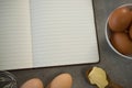 Close up of eggs by open book Royalty Free Stock Photo