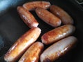 Close up of eight pork sausages