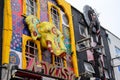 Close up of elaborately decorated, colourful shop fronts on Camden High Street