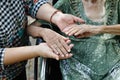 Elderly asian woman on wheelchair at home with daughter take care Royalty Free Stock Photo