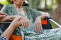 Elderly asian woman on wheelchair at home with daughter take care Royalty Free Stock Photo