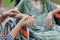 Elderly asian woman on wheelchair at home with daughter take care Royalty Free Stock Photo