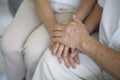 Close up of elderly hands holding each other , Grandfather hands is holding grandma hands , together , family concept