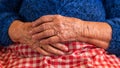 Close up elderly hands of a widowed old woman. Caucasian 90s grandma sitting