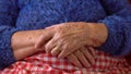 Close up elderly hands of a widowed old woman. Caucasian 90s grandma sitting