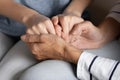 Closeup image elderly mother holding hands of grownup adult daughter Royalty Free Stock Photo