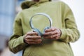 Close up of elderly man holding wireless headphones, listening music while exercising outdoors. Royalty Free Stock Photo