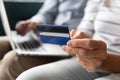 Close up elderly retired woman holding banking card in hand. Royalty Free Stock Photo