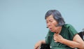 Elderly woman cough ,choke on wheelchair Royalty Free Stock Photo