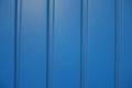 Closeup of electric blue wall with plastic siding Royalty Free Stock Photo