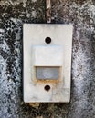 Close up of electric doorbell on concrete wall