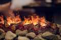 Close up of electric fireplace with orange and yellow fire flame. Royalty Free Stock Photo