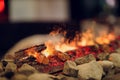 Close up of electric fireplace with orange and yellow fire flame. Royalty Free Stock Photo