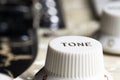 Close-up of electric guitar pickups and tone knob Royalty Free Stock Photo