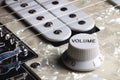 Close-up of electric guitar pickups and volume knob Royalty Free Stock Photo