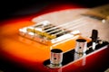 Close up of a electric guitar volume and tone knobs and bridge Royalty Free Stock Photo