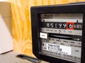 Close-up of electric meter showing measuring dial numbers. Royalty Free Stock Photo