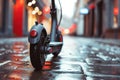 Close-up of an electric scooter parked in a city setting